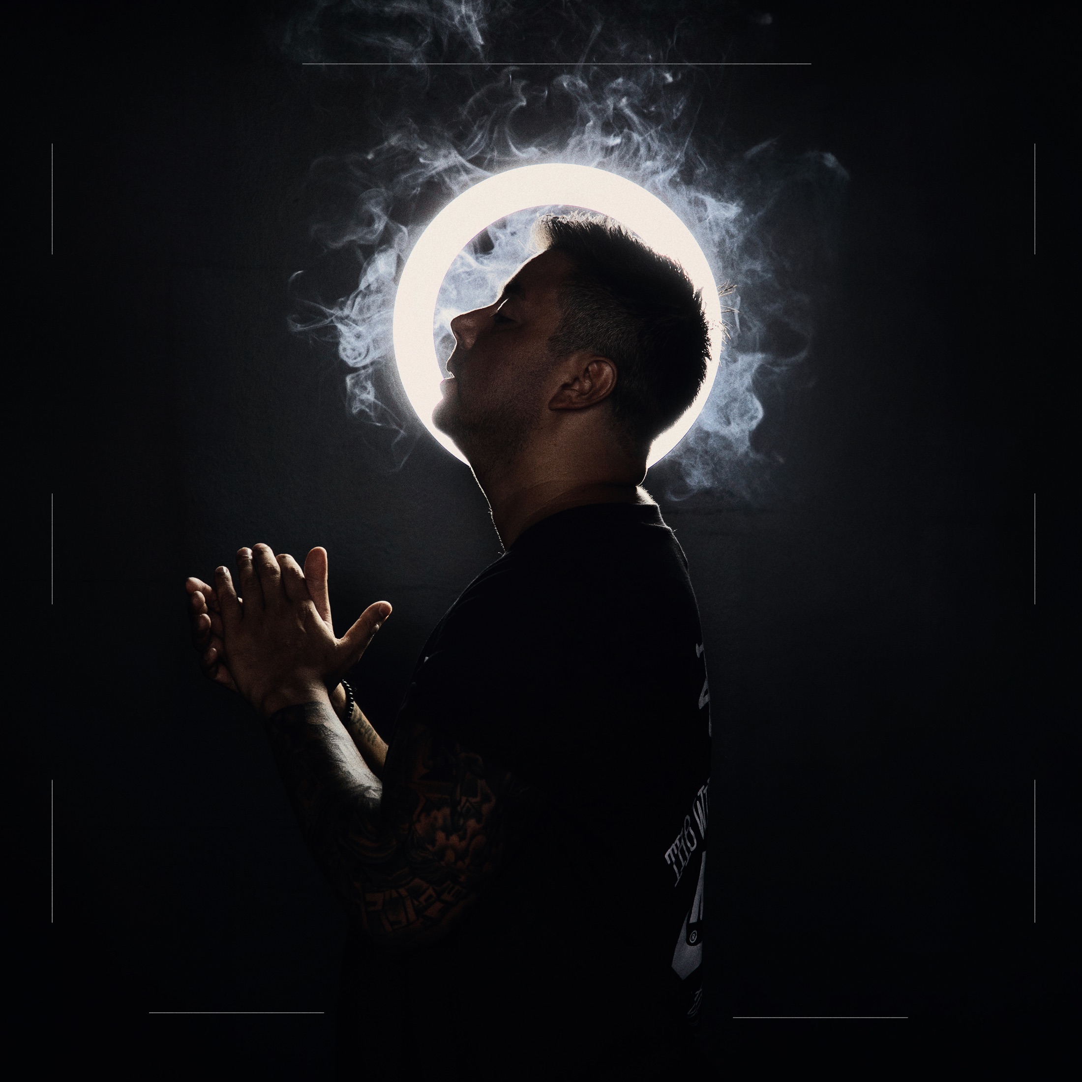 Marco Villarroel lit by a halo of light and smoke